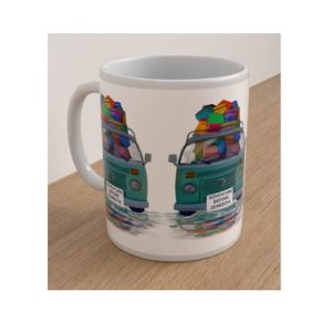 Angled view of the Adventure Before Dementia ceramic mug showing turquoise campervans loaded with colourful holiday luggage.