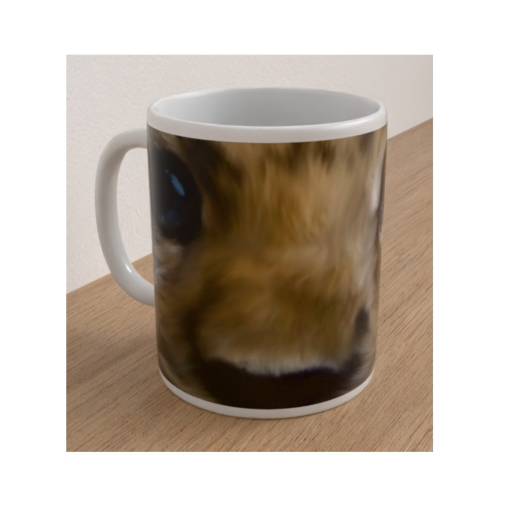 Front view of the Endangered Amur Leopard mug featuring a close-up wildlife illustration of the leopard's nose, fur and blue eyes.