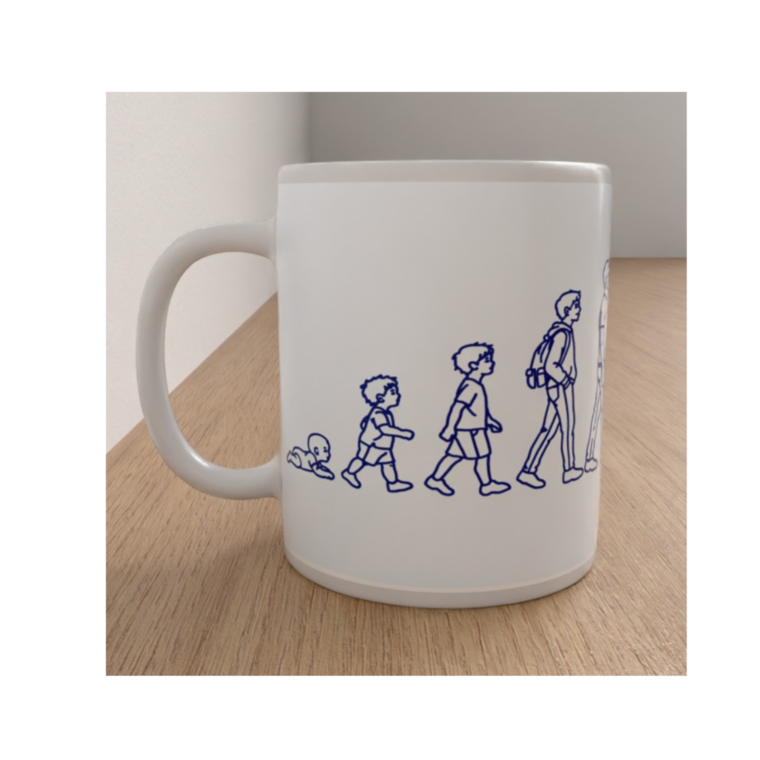 Side view of the Manhood mug featuring blue line drawings showing the stages of life from a crawling baby to a young man.