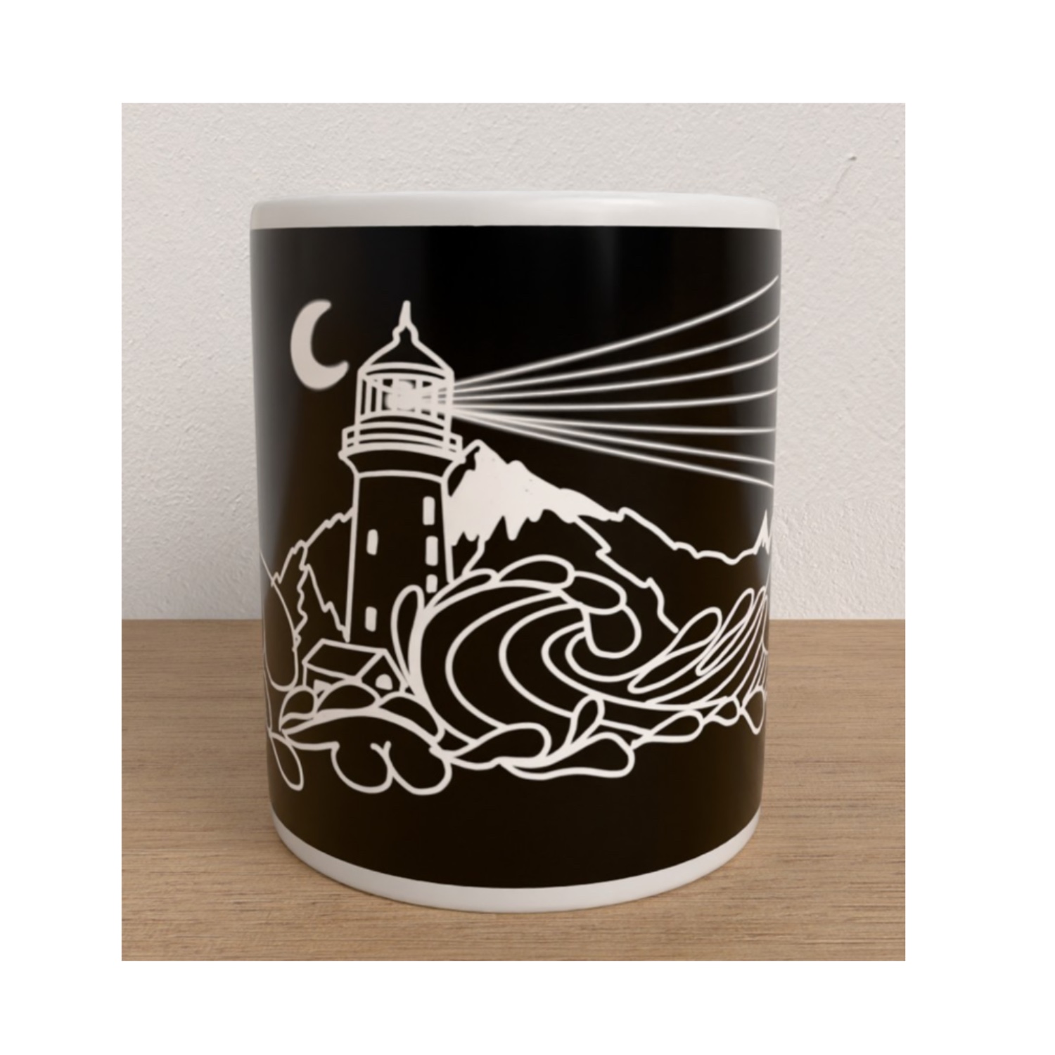 Front view of the My Lighthouse mug featuring a white lighthouse shining beams of light over dramatic waves beneath a crescent moon.