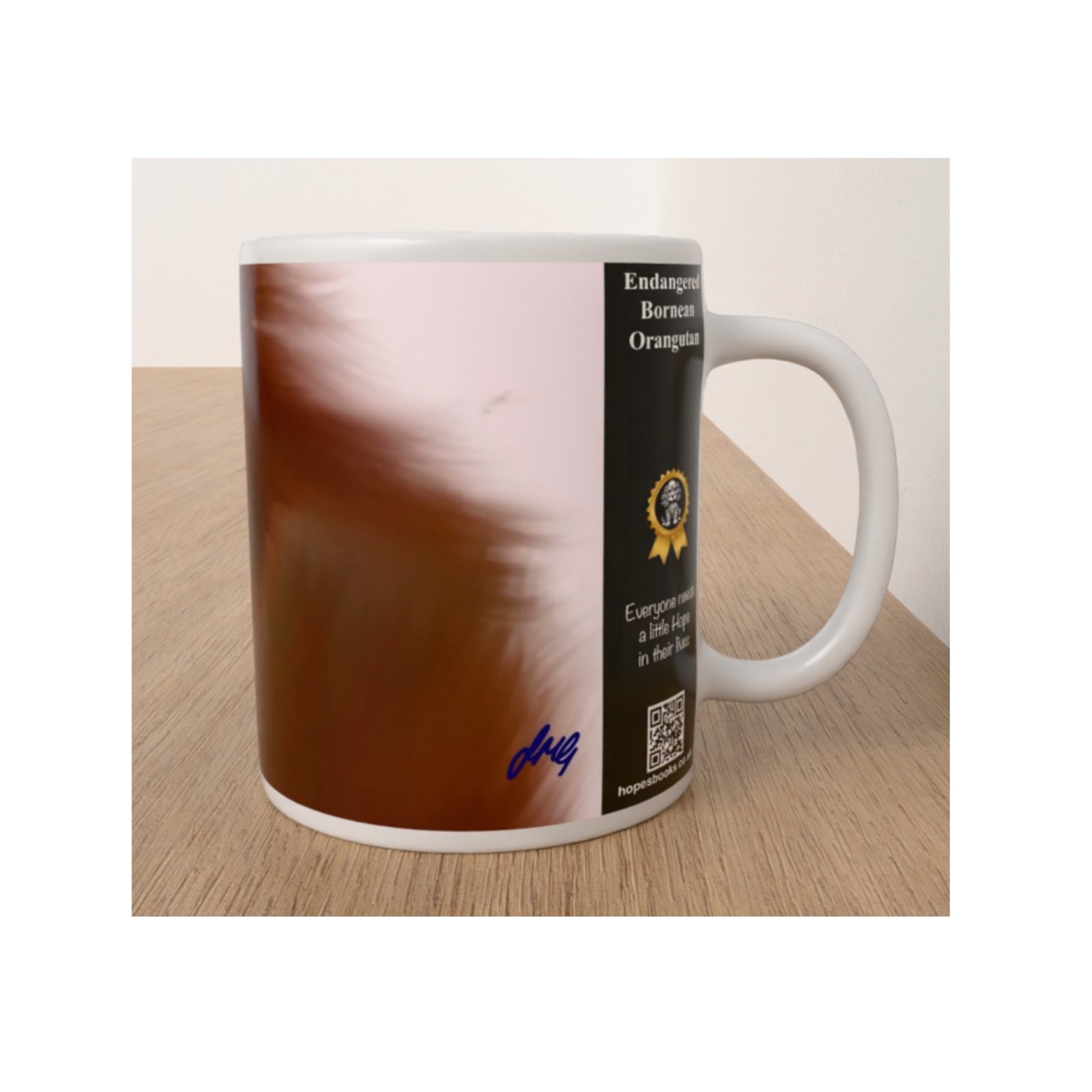 Side view of white Endangered Bornean Orangutan mug showing reddish-brown artwork, conservation message and QR code.