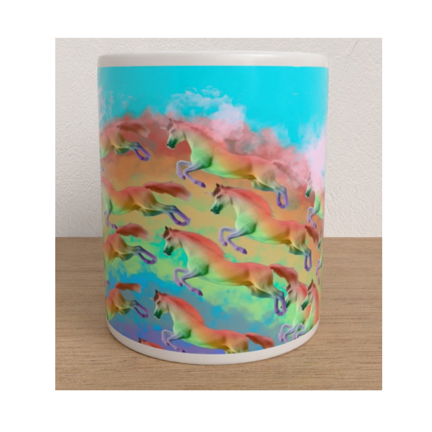 White ceramic mug covered in colourful galloping horses against a bright turquoise, pink and rainbow background.