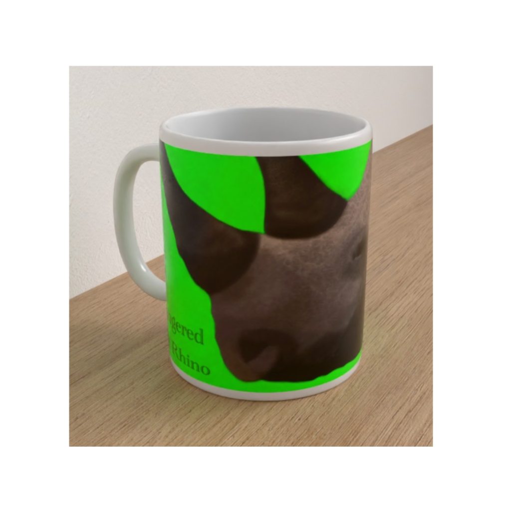 Angled view of the Endangered Black Rhino ceramic mug featuring a close-up rhinoceros illustration against a vivid green background.