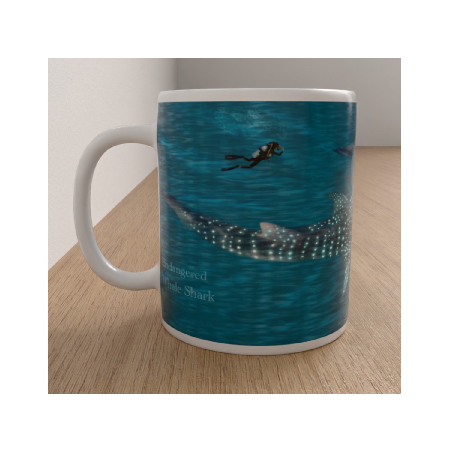 White ceramic mug featuring a spotted whale shark swimming beneath a scuba diver in blue ocean water.